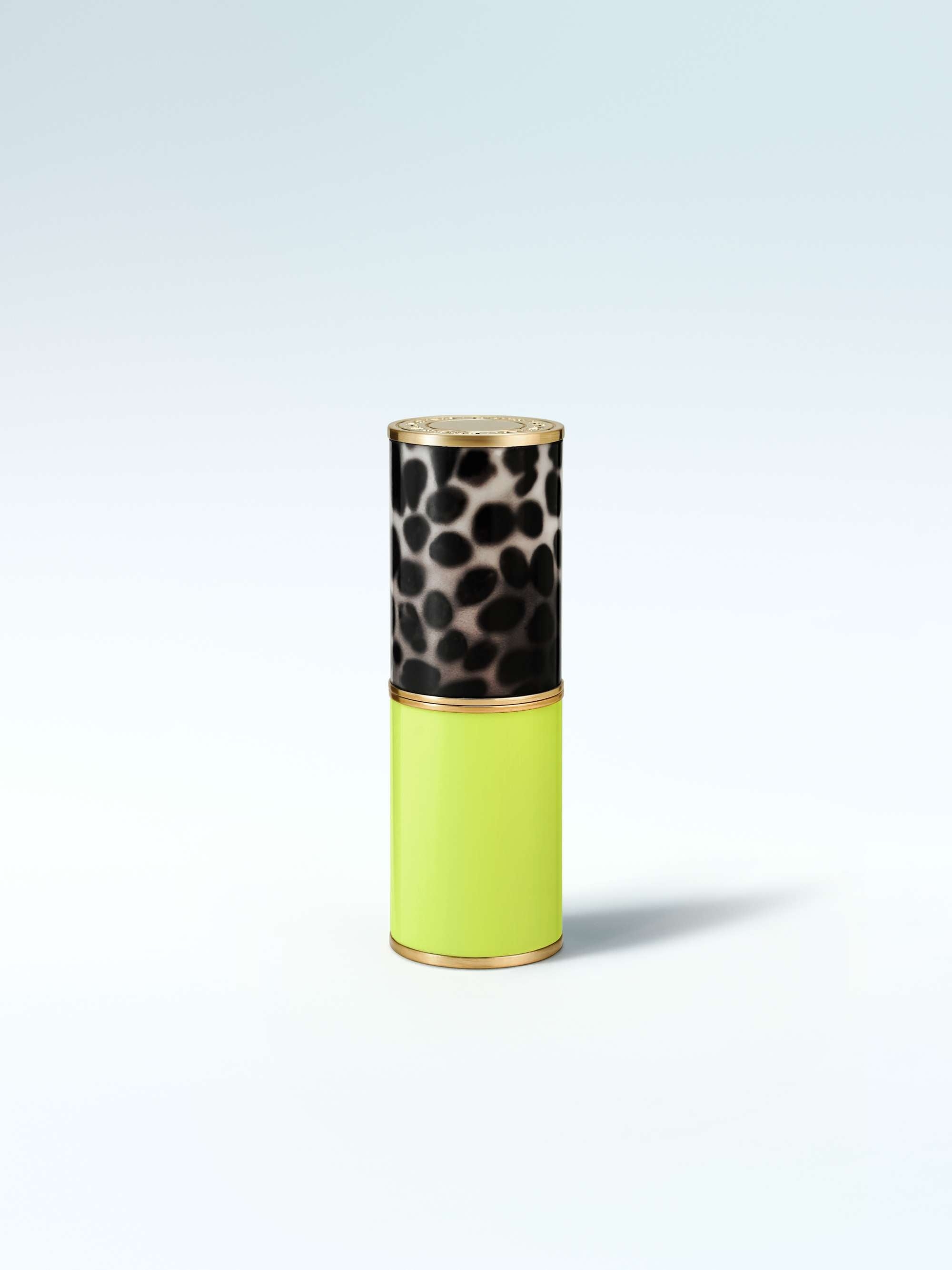 Cylindrical container with leopard print top and green body on a light gray background