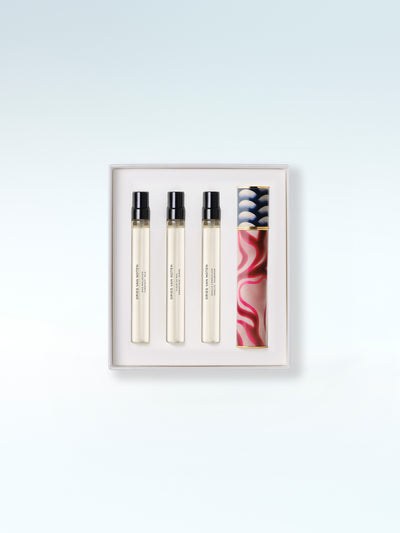 Set of three perfume bottles in a box on a light blue background - Dries Van Noten