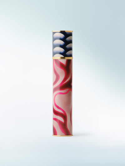 Colorful cylindrical object with abstract design on a light blue background - Dries Van Noten