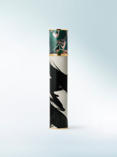 Cylindrical product with artistic design on a light blue background - Dries Van Noten