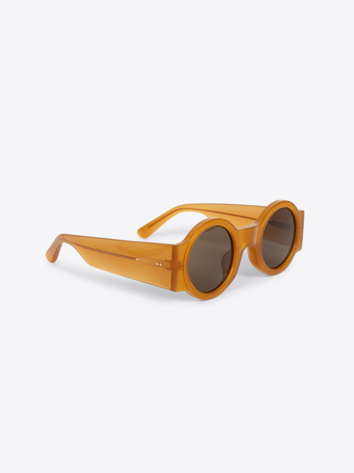 Round sunglasses with a wooden frame on a white background