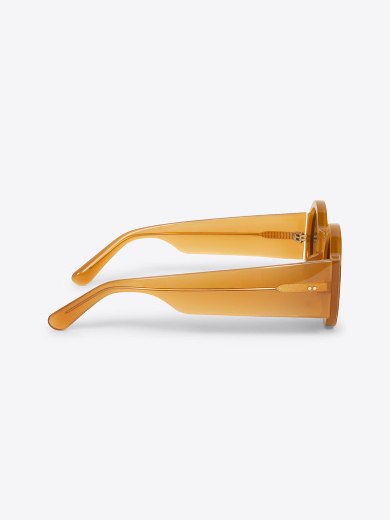 Gold-framed sunglasses on a white background