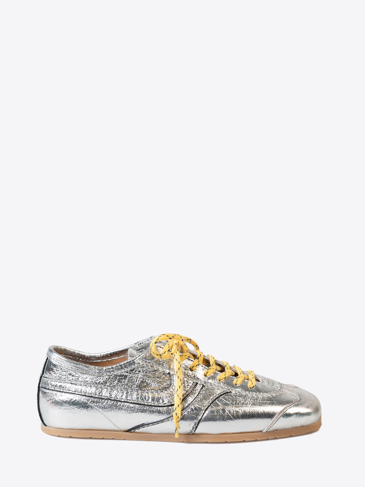 Silver sneaker with yellow laces on a white background