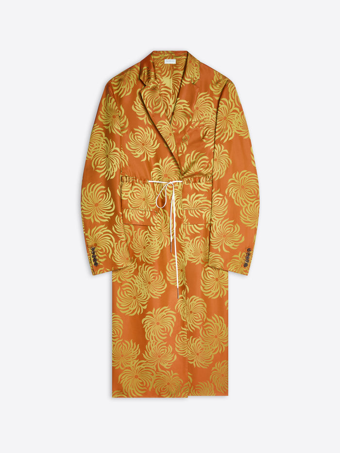 Long orange and yellow floral print coat on a white background