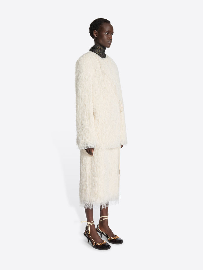 White fluffy coat and skirt on a white background