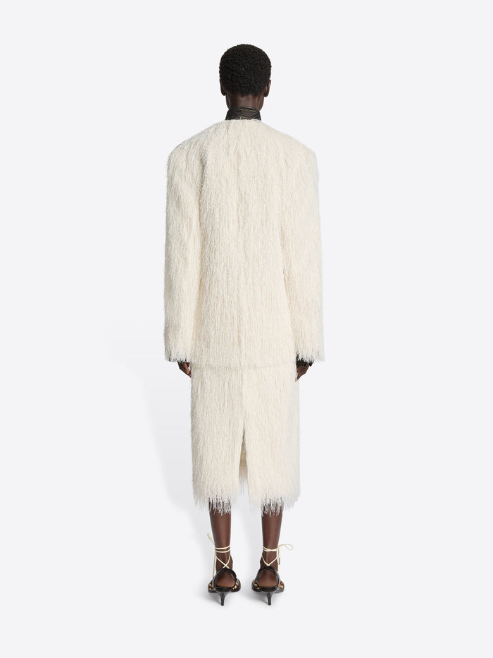 White fluffy coat and skirt on a white background