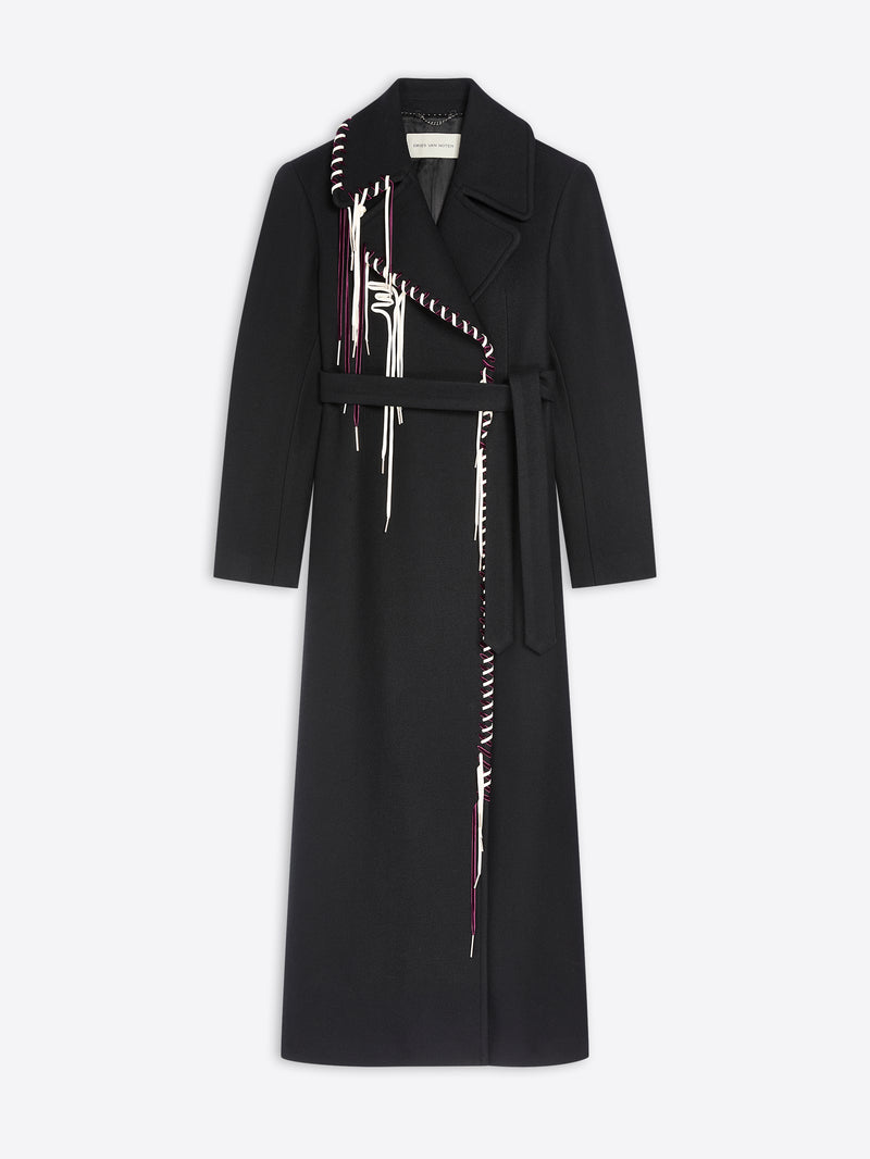 Long belted black coat with white and burgundy detailing on white background 