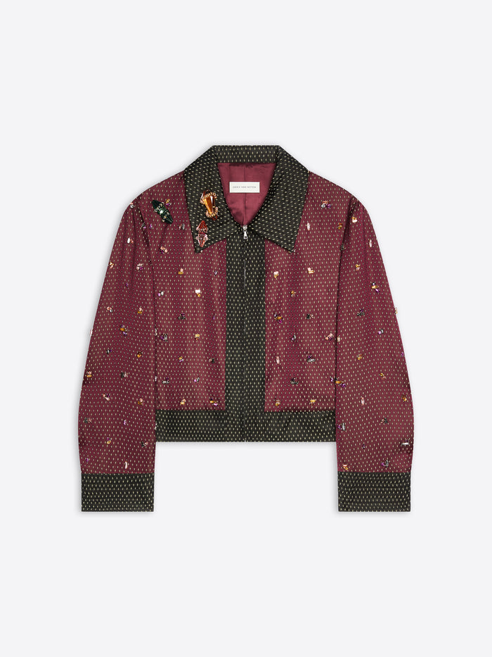 Burgundy patterned jacket with green collar on a white background