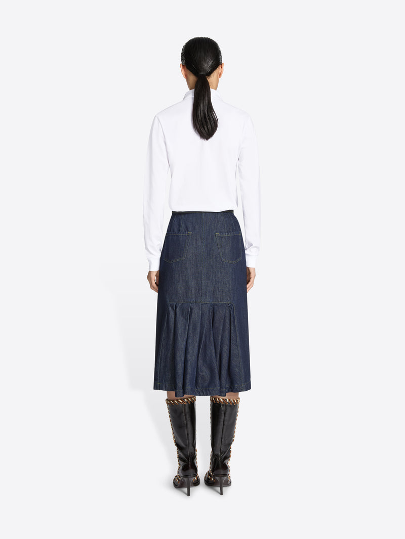 Women wearing a white blouse and blue denim elasticated midi skirt on a white background