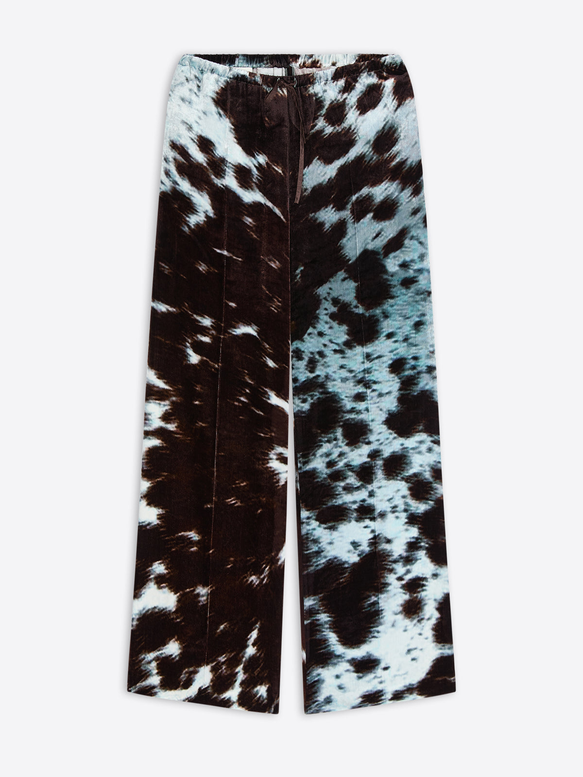 Wide-leg, elasticated pants with a black and white cowhide motif on a white background