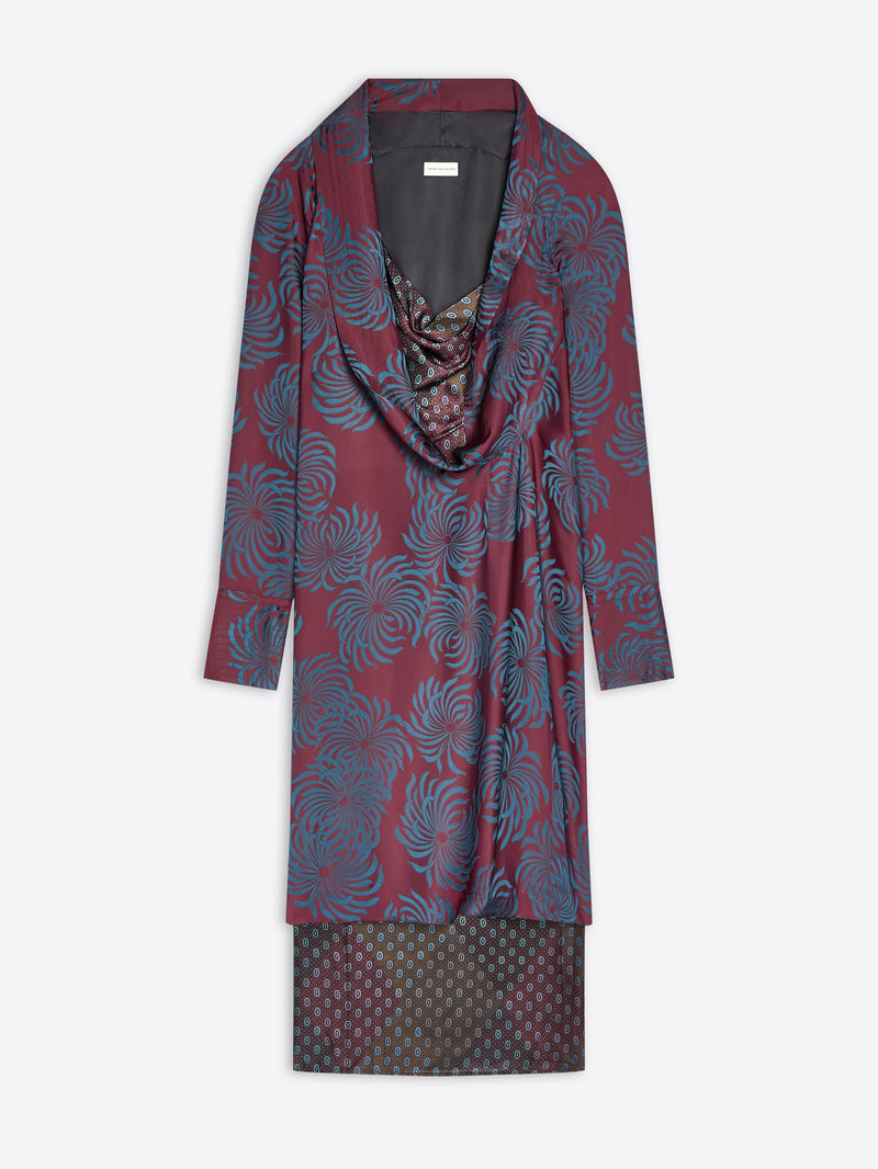 Long burgundy patterned dress with a draped effect on a white background