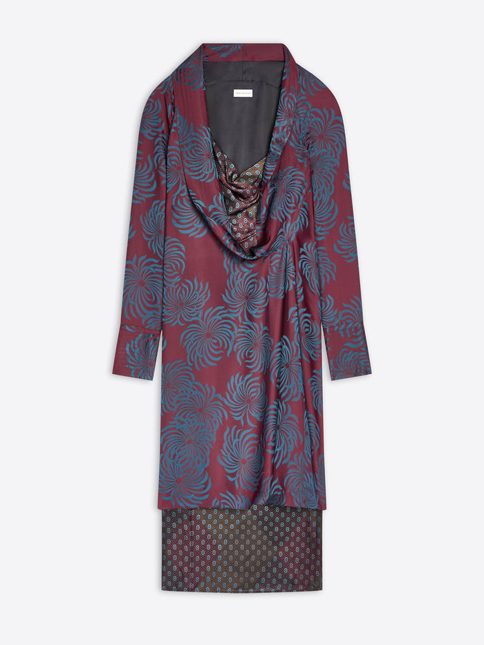 Long burgundy patterned dress with a draped effect on a white background