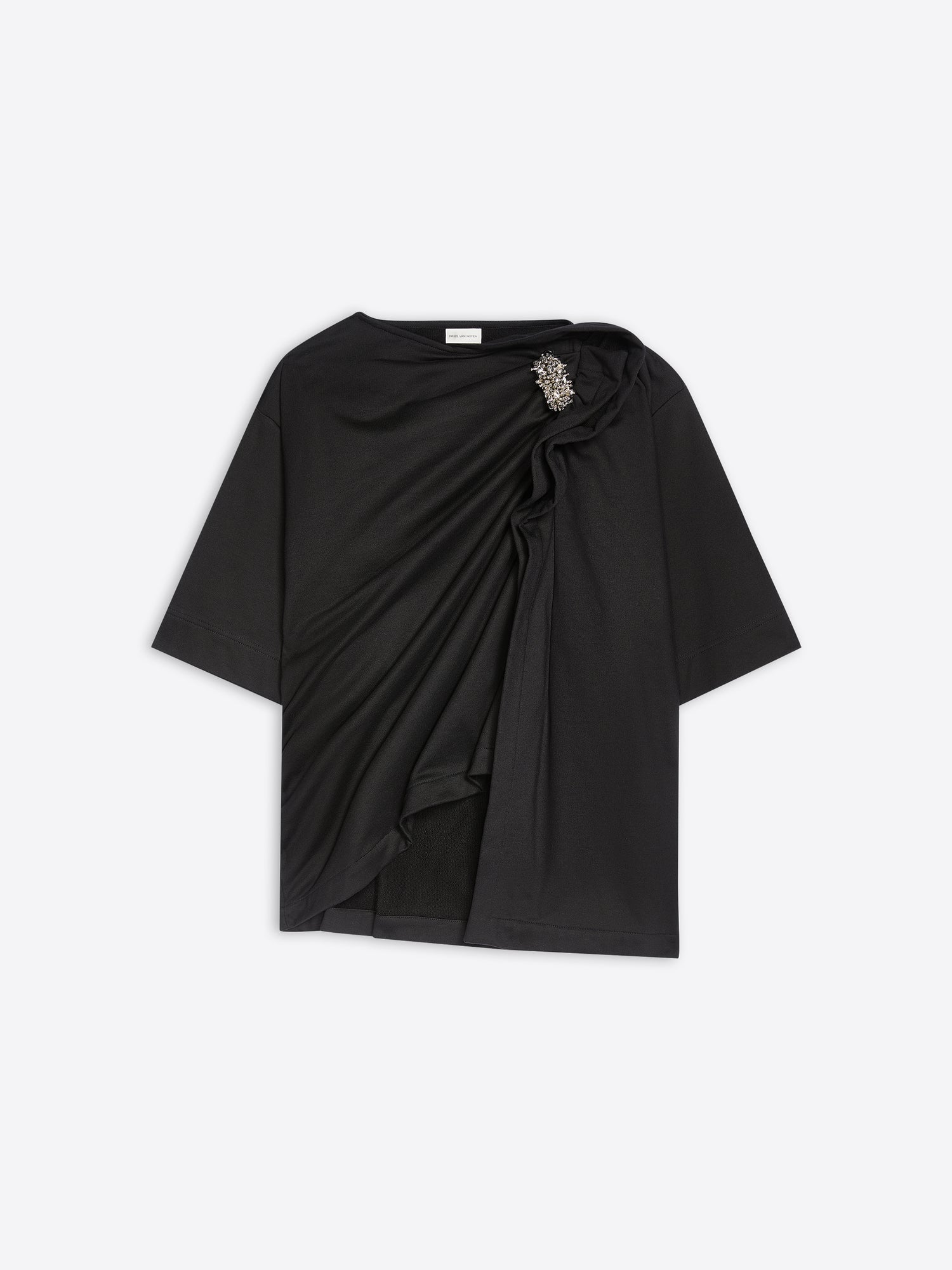 Black draped t-shirt with a brooch on a white background