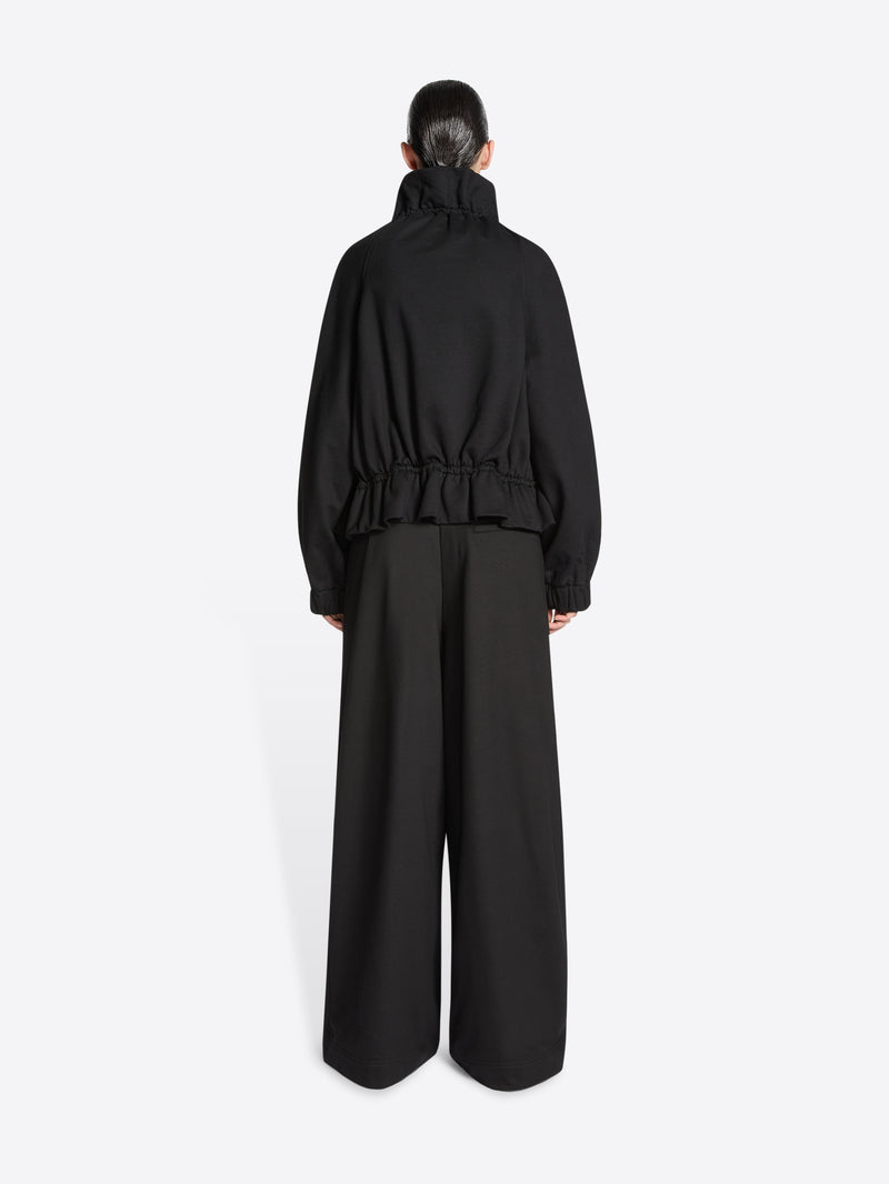 Model wearing a Black jacket on a white background