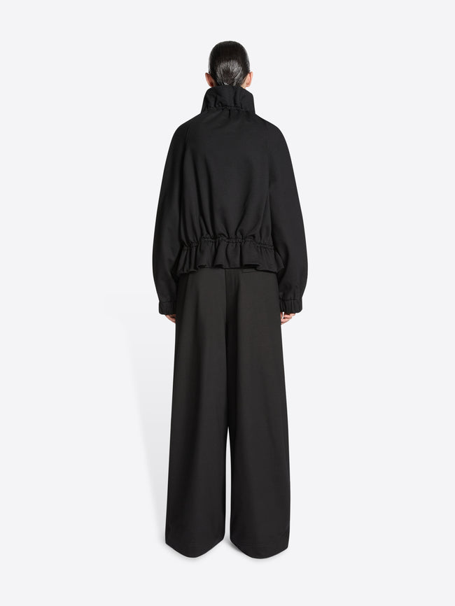 Model wearing a Black jacket on a white background