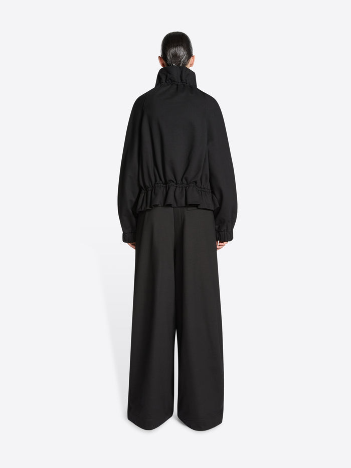 Model wearing a Black jacket on a white background