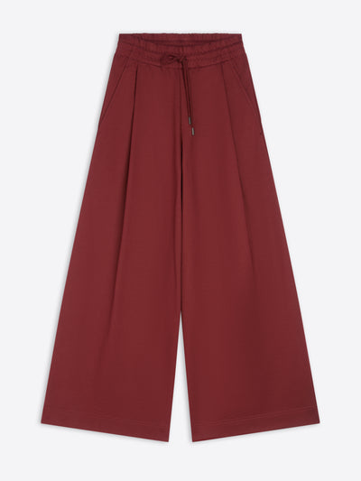 Ruby colored wide-leg sweatpants on a white background - Dries Van Noten
