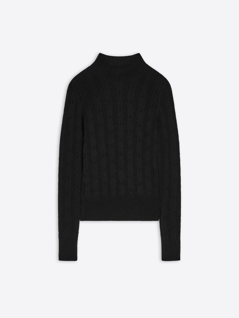 Black turtleneck sweater on a white background