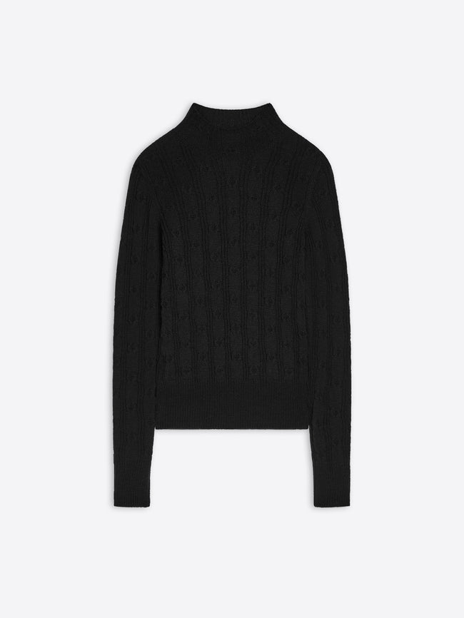Black turtleneck sweater on a white background