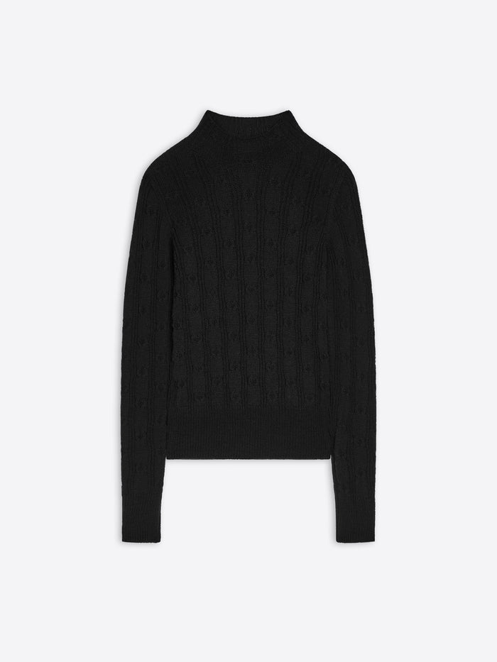 Black turtleneck sweater on a white background