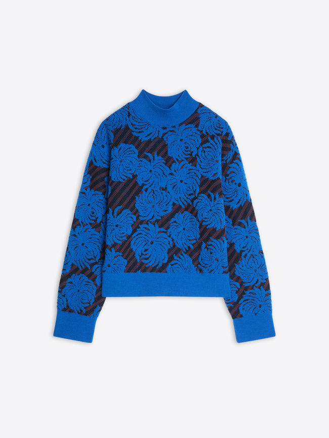 Blue sweater with flower pattern on a white background
