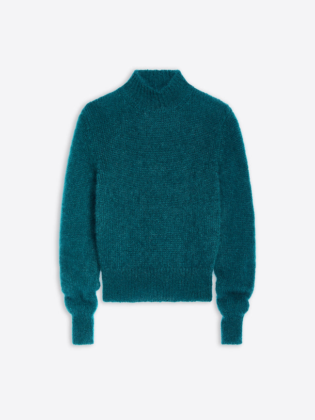 Teal sweater on a light blue background