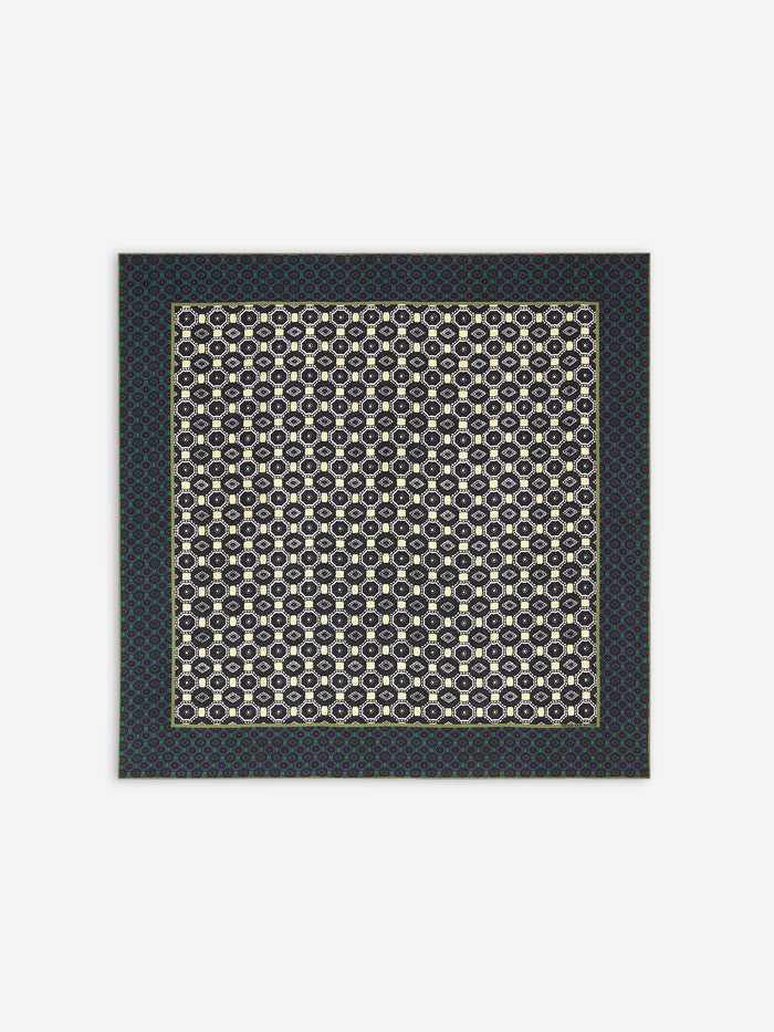 Patterned scarf with geometric design on a plain background