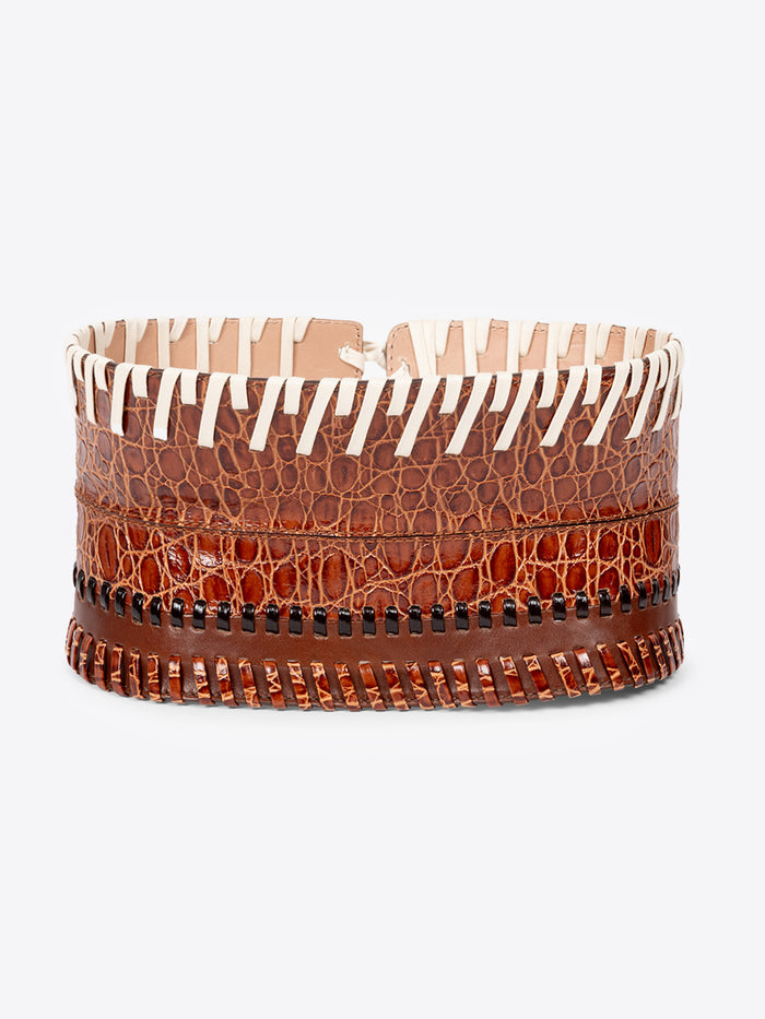 Brown leather belt with white pattern on a white background