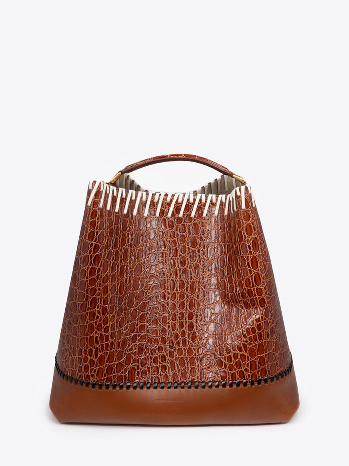 Brown leather bucket bag with a textured pattern on a white background