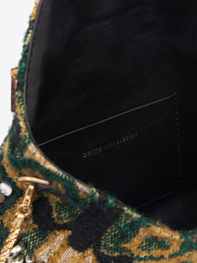 Clutch bag with floral embellishments on a white background