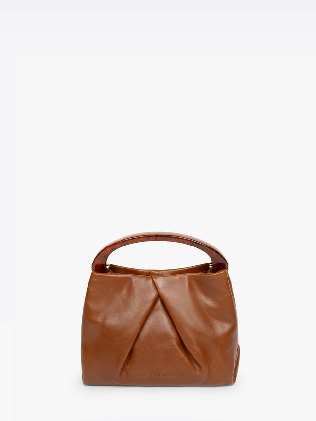 Brown leather handbag on a white background