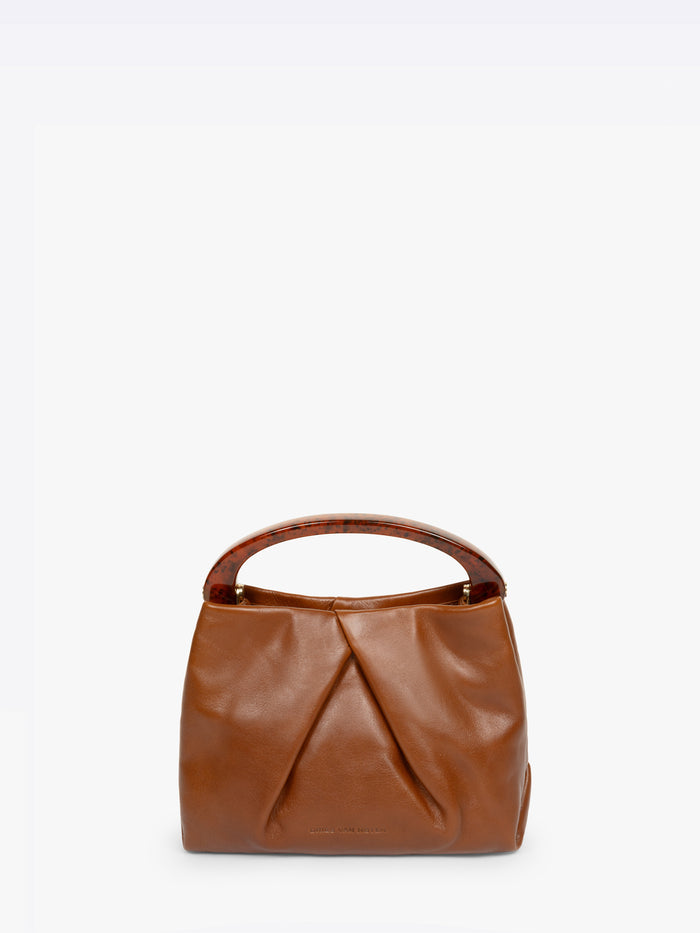 Brown leather handbag on a white background