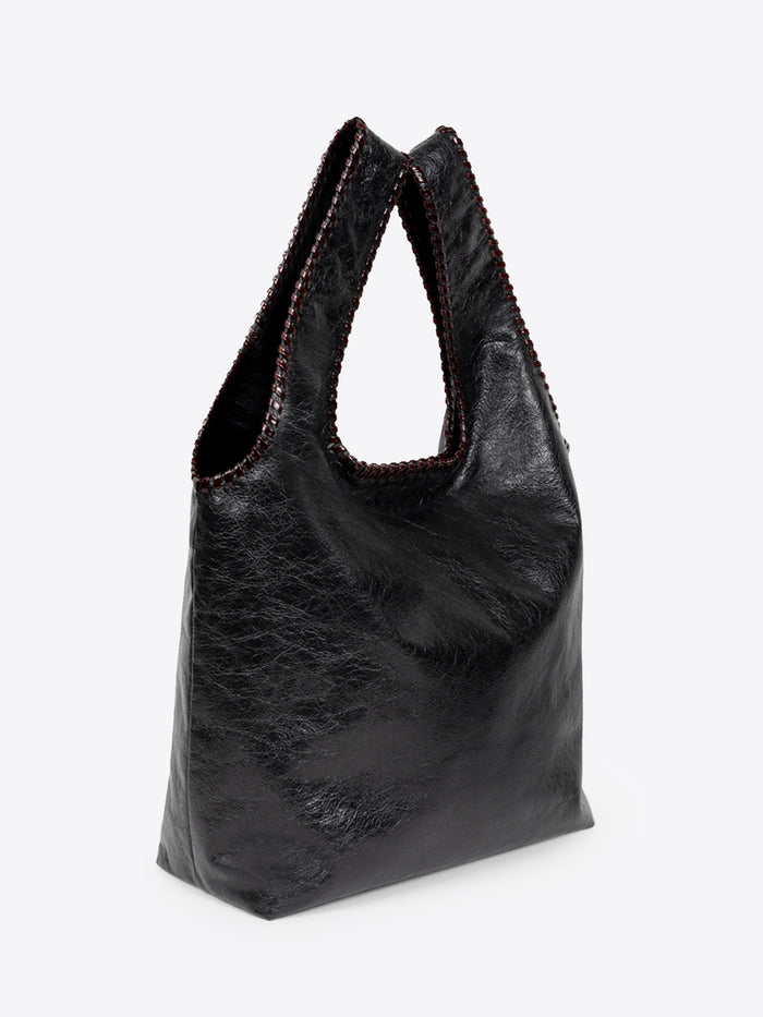Black leather handbag on a white background