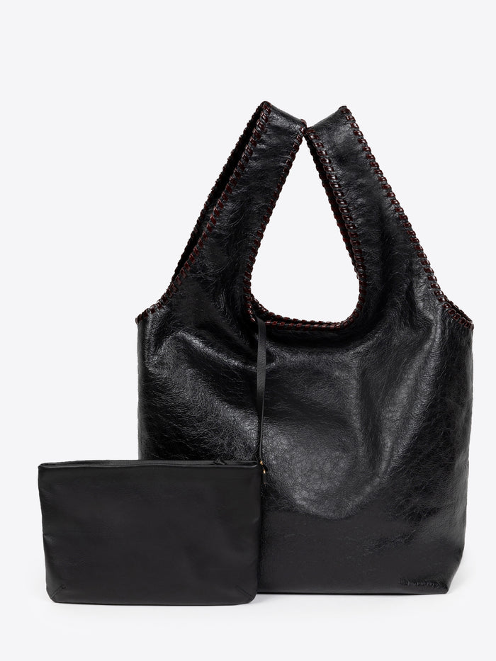 Black leather handbag with matching pouch on a white background