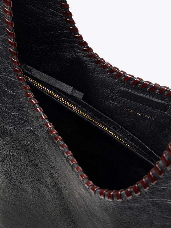 Black leather handbag on a white background