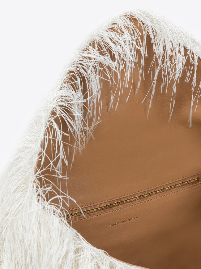 Brown leather handbag with white feather-like trim on a white background