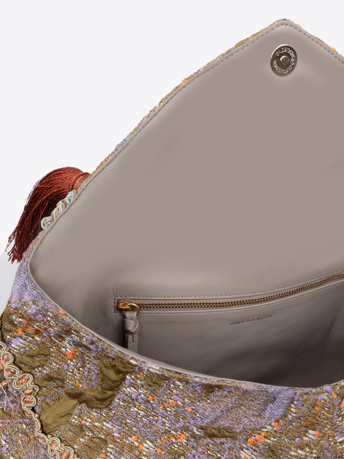 Multicolored clutch bag with tassels on a white background