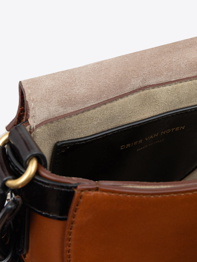 Brown handbag with a textured pattern on a white background