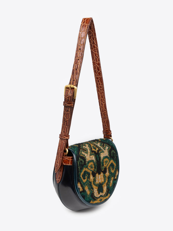 Handbag with decorative pattern on a white background