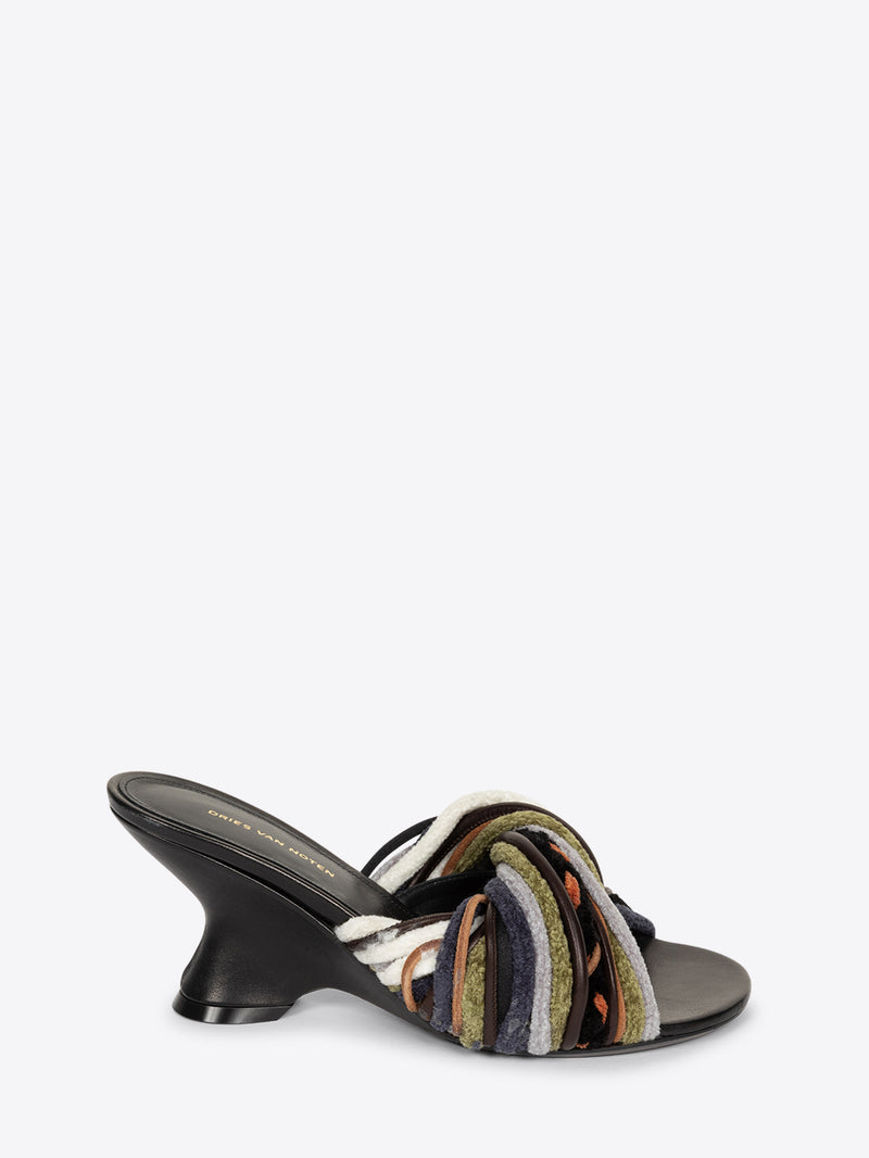 Multicolored sandal with a black heel on a white background
