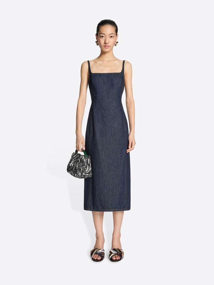 Model wearing open-toe leather mules