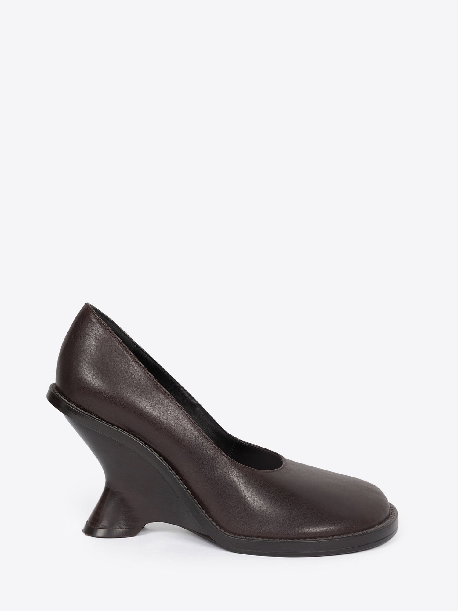 Dark brown leather wedge pump on a white background