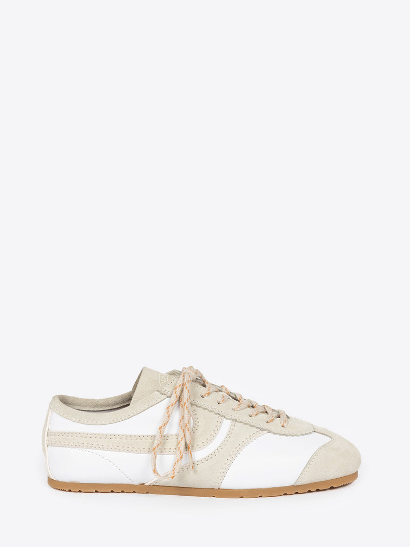 White, with beige accents, suede sneaker on a white background