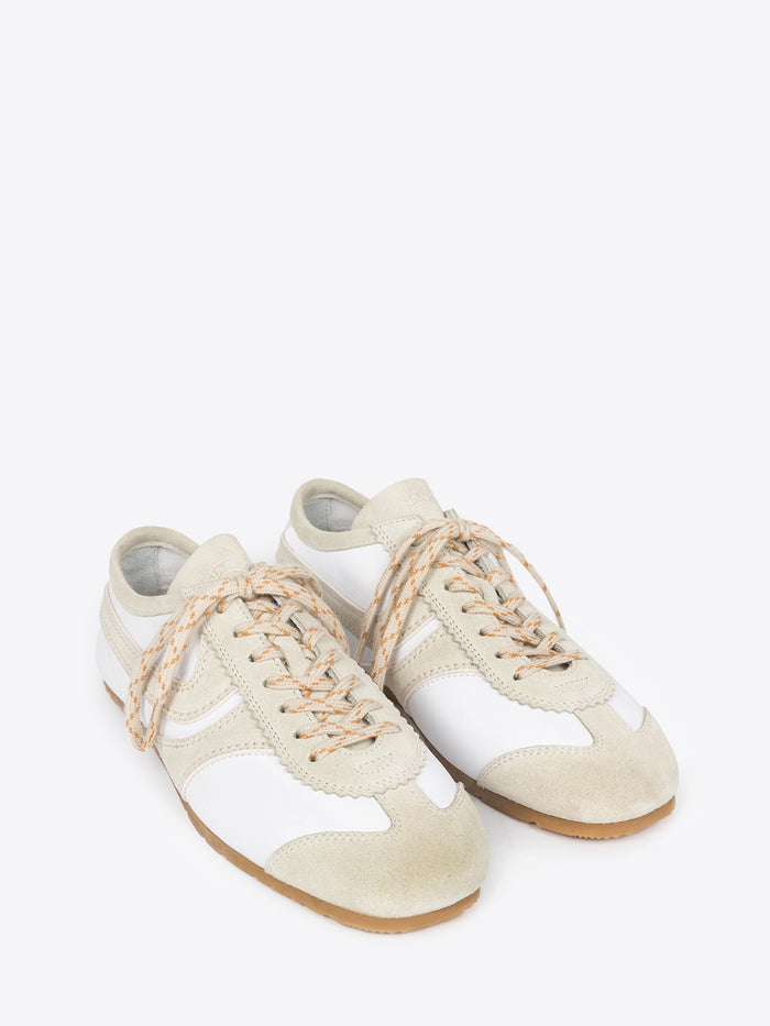 A pair of white, with beige accents, suede sneakers on a white background