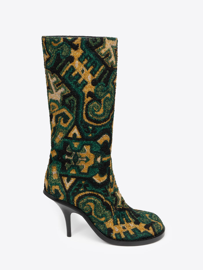 Green, yellow and black patterned round-toe, stiletto heel jacquard boot on a white background