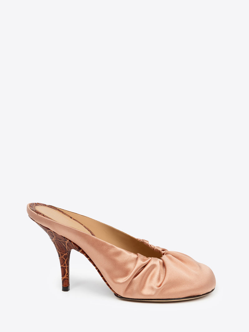 Pink high-heeled shoe on a white background