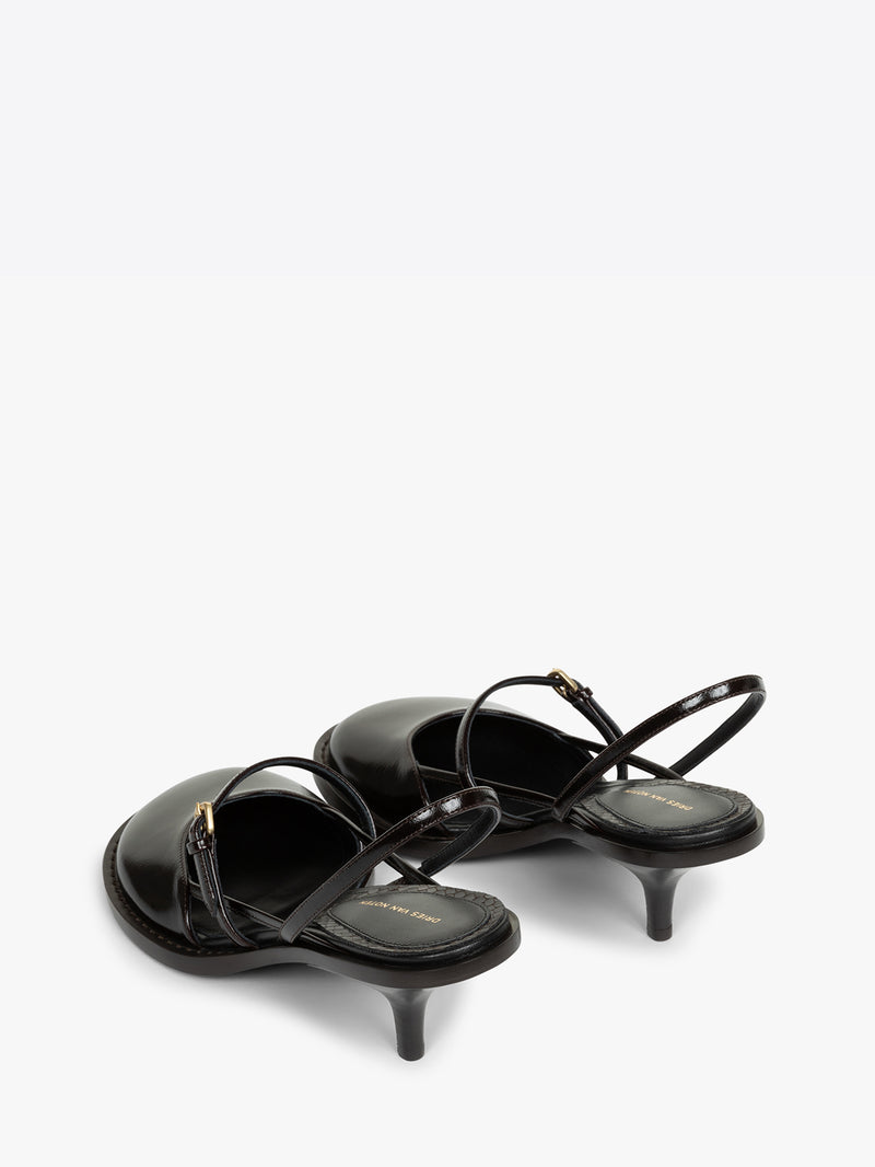 Black high-heeled sandals with thin straps on a white background