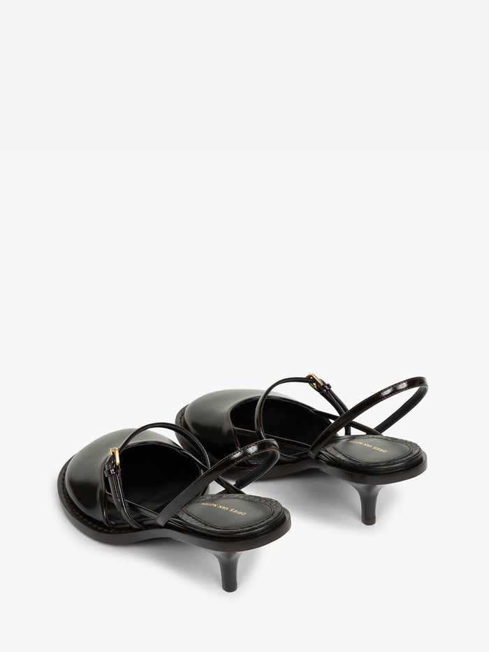Black high-heeled sandals with thin straps on a white background