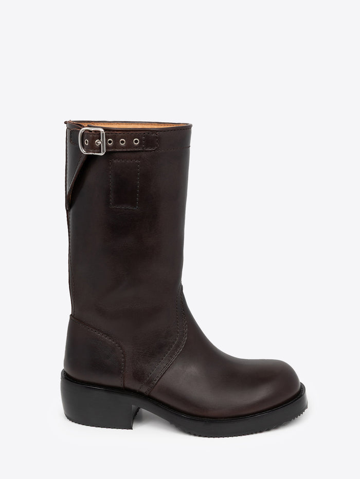 Brown leather boot with a buckle on a white background