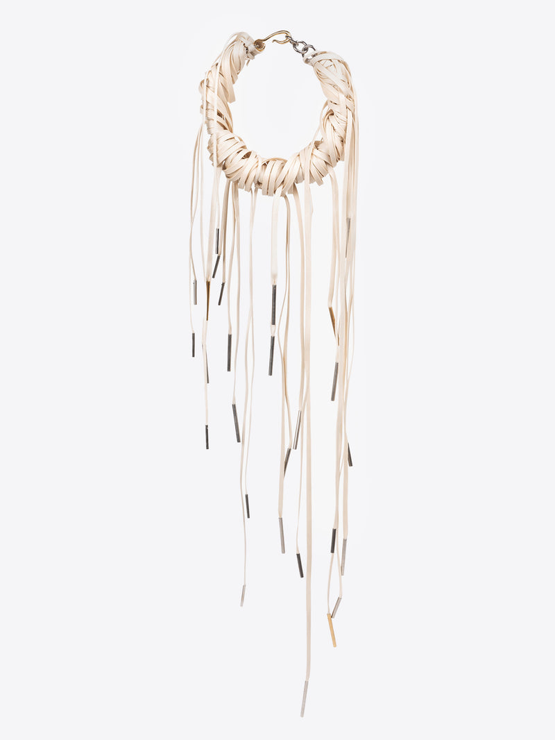 Necklace with long hanging elements on a white background